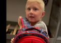 Son with bulletproof backpack
