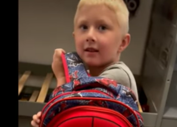 Son with bulletproof backpack
