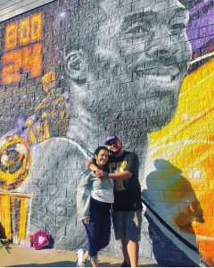 Michael Marin Rivera standing in front of Kobe Bryant's mural