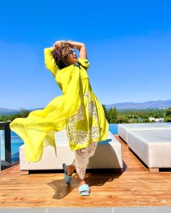 Priyanka Chopra wearing a Yellow dress enjoying sunshine