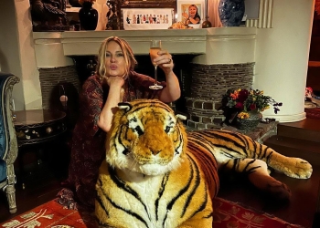 Jennifer Coolidge drinking wine