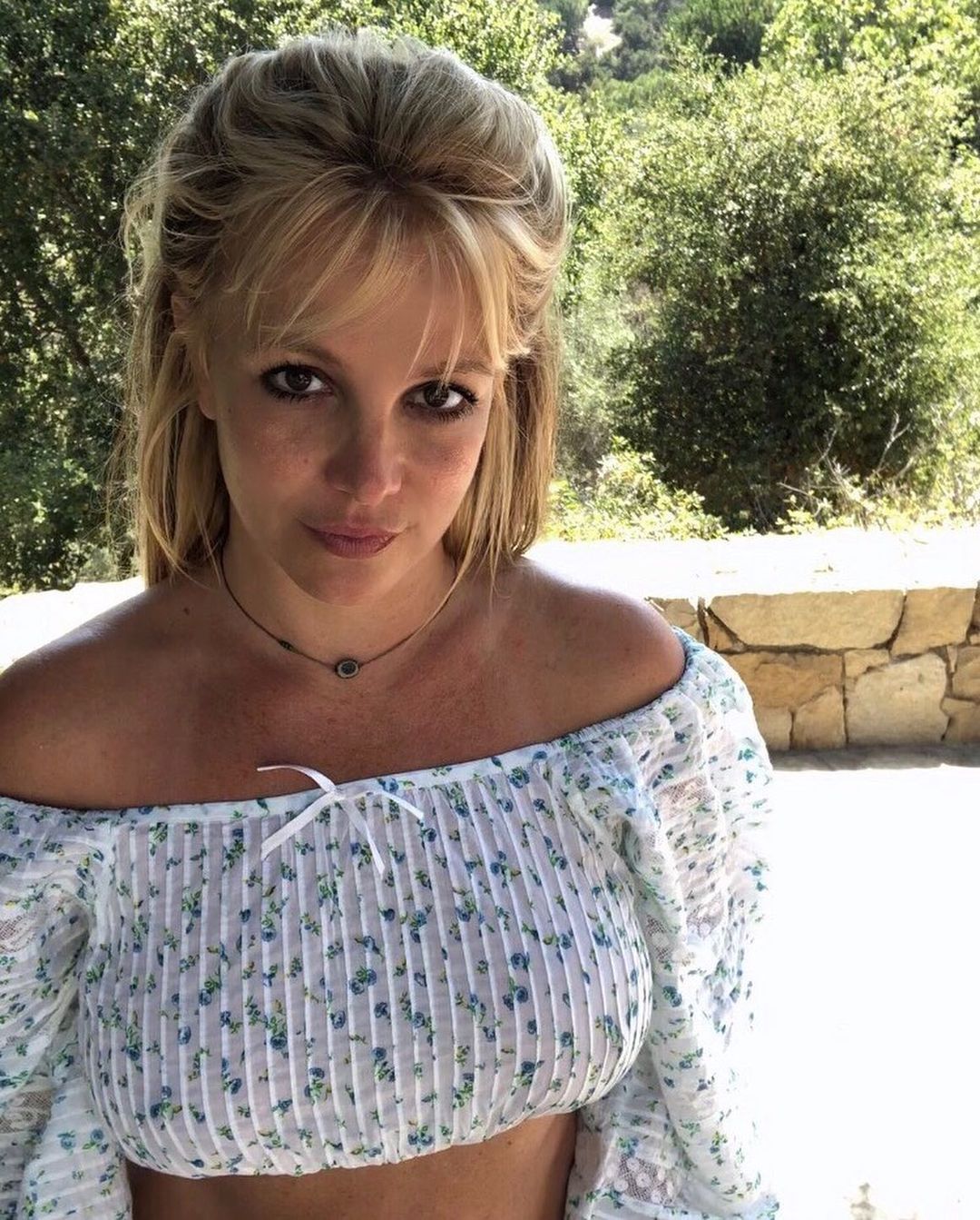 Britney Spears wearing a white top