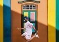Hardy Singh wearing a blue turban and white shoes