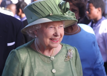 Queen Elizabeth II wearing green hat