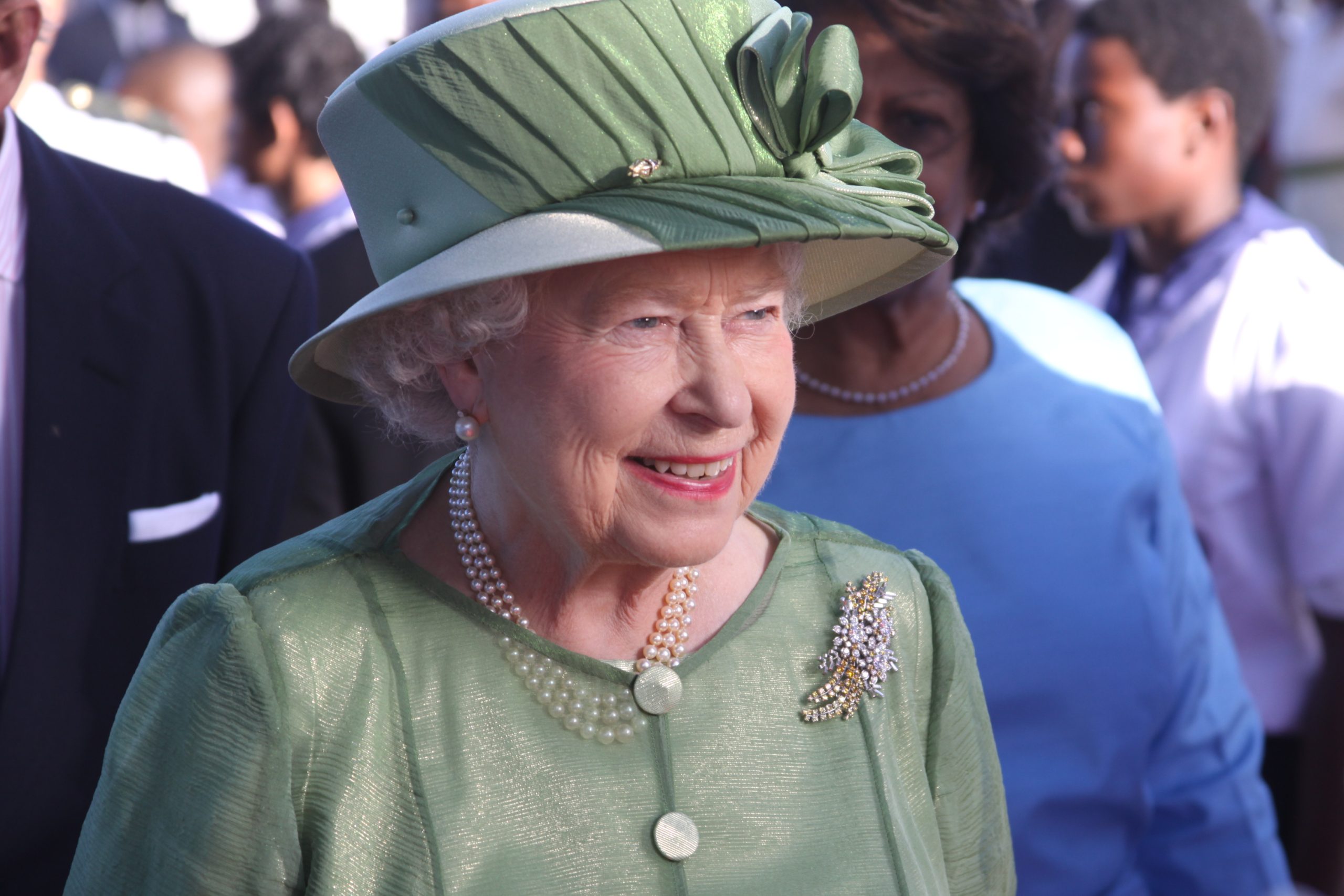 Queen Elizabeth II wearing green hat