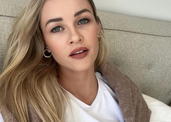 Ambyr Childers wearing a white top and taking selfie