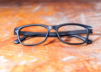 black glasses on wooden table