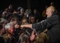 John Fetterman greeting people in a gathering