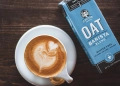 oat milk pack with a cup of coffee
